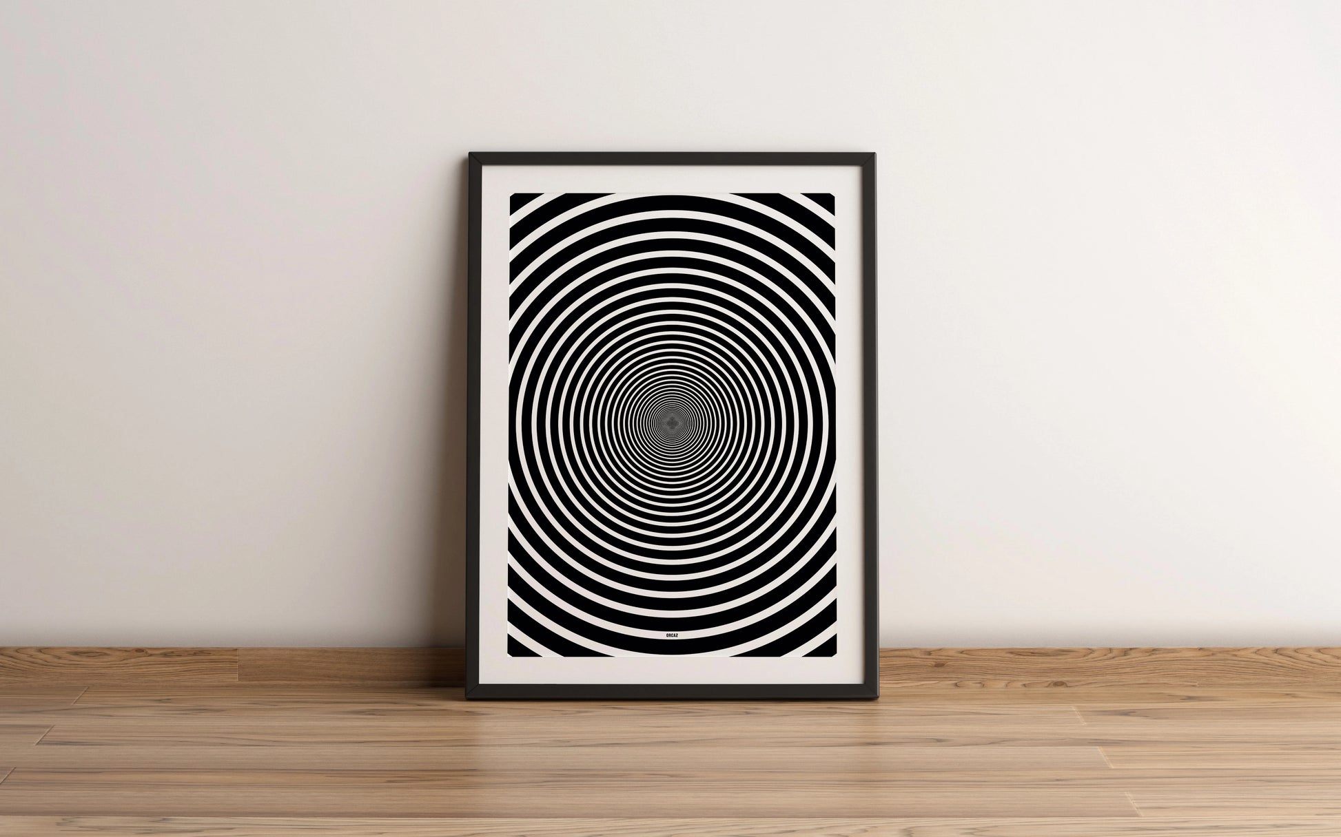 Affiche encadrée abstraite en noir et blanc avec un motif de cercles concentriques pour créer un effet optique hypnotique et captivant vers le centre, par Orcaz Designs.