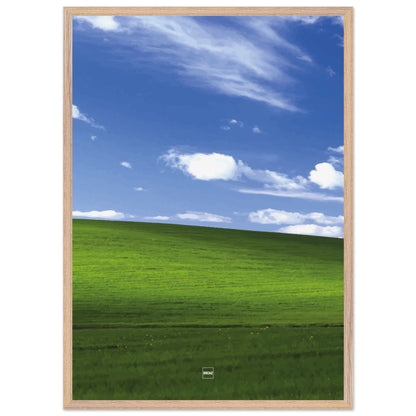 Réplique avec encadrement du fond d'écran Bliss avec une colline verdoyante, un ciel bleu et des nuages blancs.