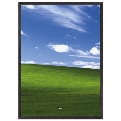 Réplique avec encadrement du fond d'écran Bliss avec une colline verdoyante, un ciel bleu et des nuages blancs.