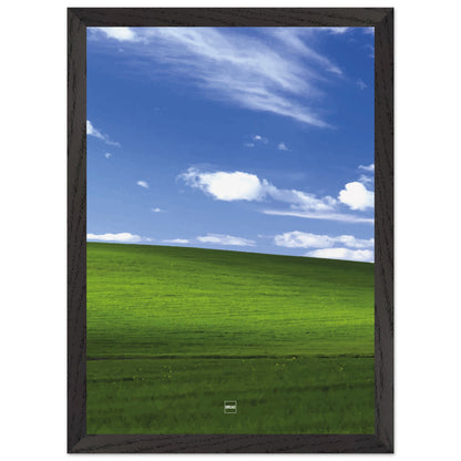 Réplique avec encadrement du fond d'écran Bliss avec une colline verdoyante, un ciel bleu et des nuages blancs.