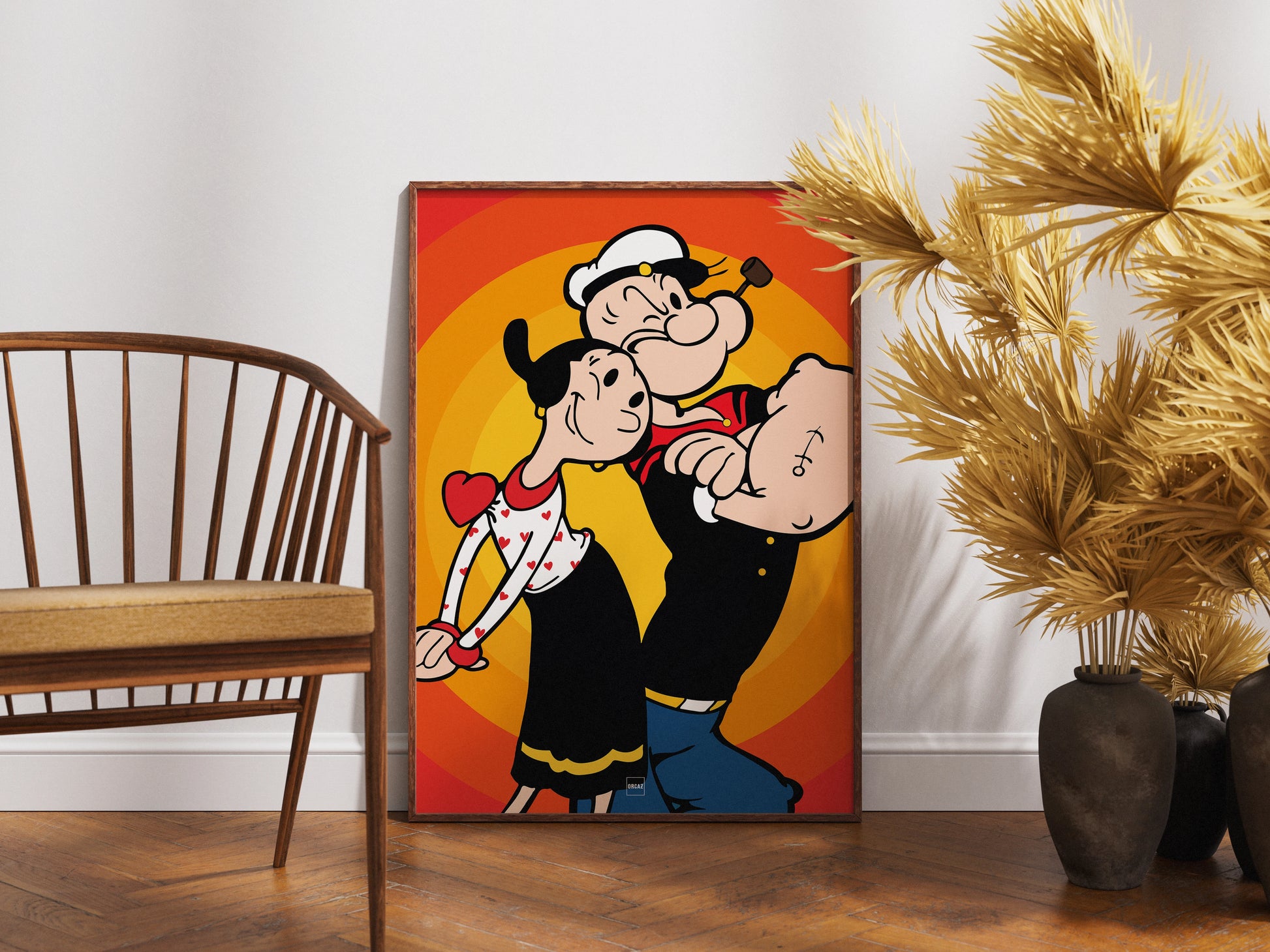Affiche encadrée en bois du personnage Popeye sur fond orange et rouge.